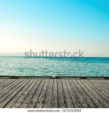 gray wooden pier of free space for your decoration and landscape of ocean with blue sky 