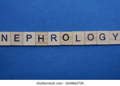 Gray Word Nephrology From Small Wooden Letters On A Blue Table