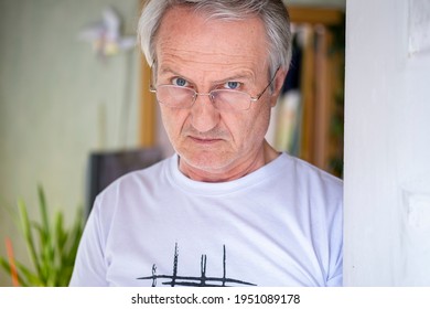 Gray-haired Elderly Man In A Doorway In A Bright Room