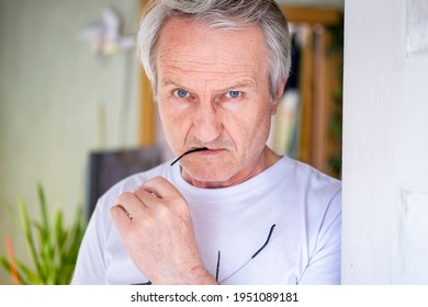 Gray-haired Elderly Man In A Doorway In A Bright Room