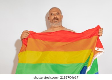 A Gray-haired Man Waving An Lgbt Flag In Front Of Him. Lgbt Community Glory Concept.