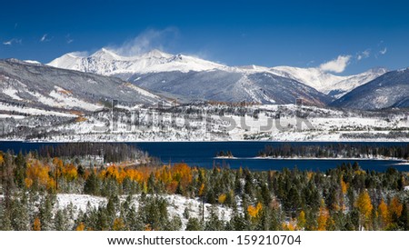 Grays and Torreys Peaks in the Colorado Rocky Mountains with Snow on Aspen Trees and Lake Dillon in the Foreground