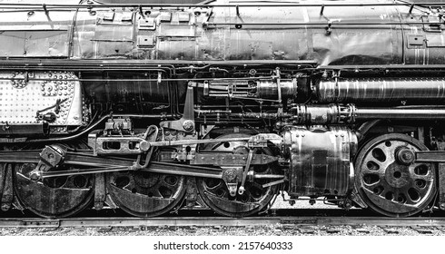 A Grayscale Closeup Of The Union Pacific Big Boy Locomotive Wheels And Mechanical Parts