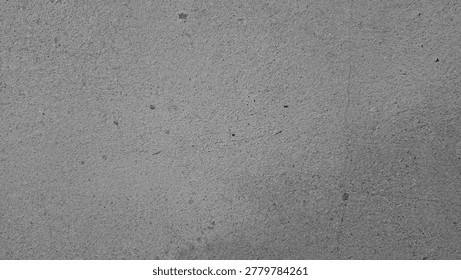 Grayscale concrete wall texture background with natural grain and subtle hairline cracks.