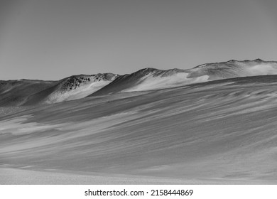 A grayscale shot of a beautiful mountainous landscape