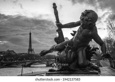 A Grayscale Shot Of The Bronze Cherub Statue In Paris