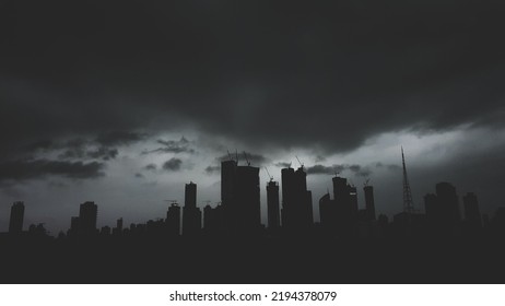 A Grayscale Shot Of Silhouettes Of The Skyscrapers Of Mumbai In A Mysterious Monsoon