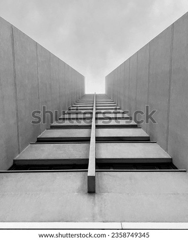 A grayscale shot of a tall building