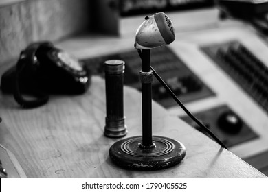 A Grayscale Shot Of Vintage Old School Microphone