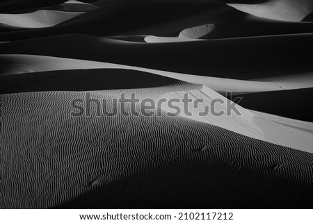 A grayscale  viewof desert sand dune