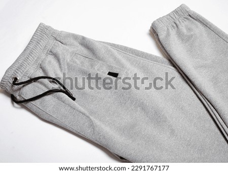 GraySport Sweatpants Isolated on White Background. Folded Gray pants
