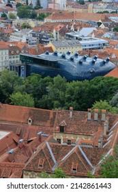 Graz, Austria-June 17 2017: View From The Castle Mountain To The City With The Modern Museum Called Kunsthaus Graz Situated At The River Mur