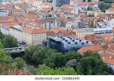 Graz, Austria-June 17 2017: View From The Castle Mountain To The City With The Modern Museum Called Kunsthaus Graz Situated At The River Mur