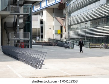 Graz, Styria/Austria - March 29 2020: An Editorial Photo Of A Security Guard Walking Around The Deserted Campus Of The University Of Graz Due To The Coronavirus Restrictions Of The Austrian Government