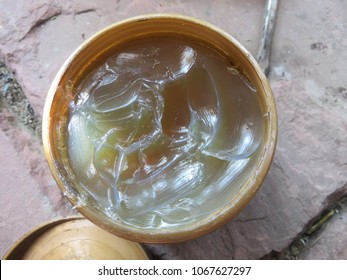 Grease or semisolid lubricant in a plastic container, consists of a soap emulsified with mineral or vegetable oil, a high initial viscosity, also act as sealants to prevent ingress of water