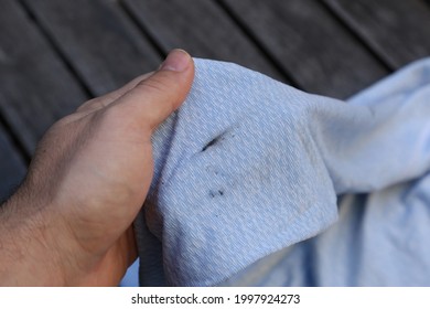 Grease Stain On A Blue Jersey. This Photo Has Selective Focus. 