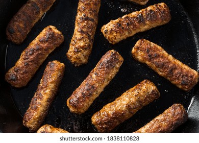 Greasy Cooked Pork Breakfast Sausage For Breakfast With Eggs