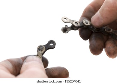 Greasy Hands Holding Bicycle Chain