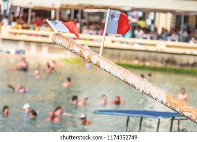 Greasy Pole, Maltese Flags. Xlendi Bay Gozo Feast