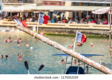 Greasy Pole, Three Maltese Flags. Xlendi Bay Gozo Feast