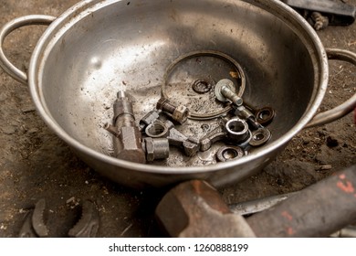 Greasy Tools On Dirty Concrete Floor. Messy Garage