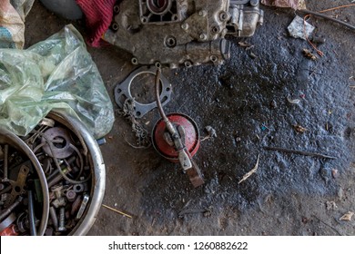 Greasy Tools On Dirty Ground. Garage