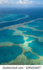 Great Barrier Reef as seen from above from a plane at the coast of the Whitsunday Islands (Queensland, Australia) - Shutterstock ID 1290654697