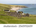 Great Blasket Island landscape, with view over to White Strand beach and abandoned houses in the foreground, Ireland