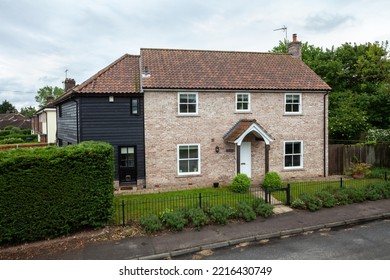 Great Bradley, Suffolk, England - May 19 2017: Modern Detached Brick House With Small Landscaped Garden.