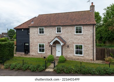 Great Bradley, Suffolk, England - May 19 2017: Modern Detached Brick House With Small Landscaped Garden.