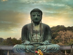 The "Great Buddha" (Daibutsu) Bronze Statue At The Kotoku-in Buddhist Temple In The City Of Kamakura In Kanagawa Prefecture, Japan - The Statue Has Been Designated "National Treasure" Status.