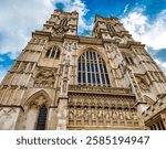 Great close-up view of the west front of the famous Westminster Abbey with its two western towers and the ten statues of 20th-century Christian martyrs above the Great West Door.