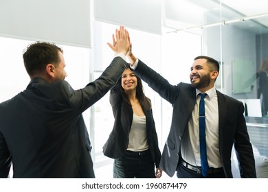 Great Collaborative Teamwork. Happy Business Colleagues Doing A High Five And Celebrating Winning A Big Business Deal At The Company