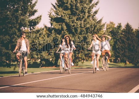 Similar – Happy young people having fun with skateboard and bicycle