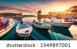 Great evening view of Gulf of Corinth, Greece, Europe. Attractive sunset on popular touristic destination - Nafpaktos port. Calm seascape of Ionian sea. Traveling concept background.