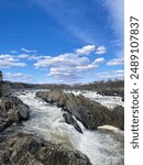 Great Falls Park Virginia waterfall on a partly cloudy spring morning. 