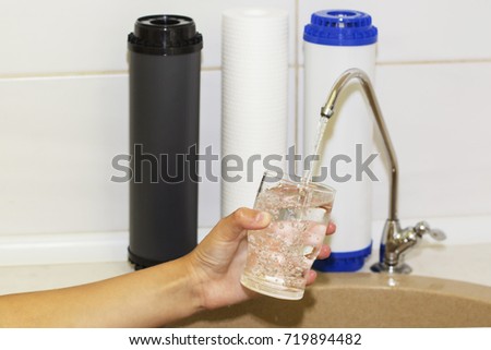 Great filters to purify your drinking water an image isolated in the kitchen interior.