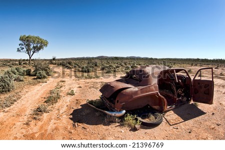 great image of an old car rusting away in the desert