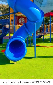 Great kids playground. Attraction "Spiral hill with a closed descent." Bright warm sunny morning. The concept of physical and mental development of children