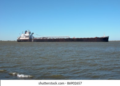 A Great Lakes Self-unloading Bulk Carrier Ship Navigates The Waters Inside The Lake Erie Break Wall Heading To The Cleveland Bulk Terminal Dock