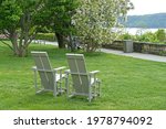 Great Lawn with chairs and magnificent views of Hudson River.  Wave Hill in Hudson Hill of Riverdale in Bronx, New York City
