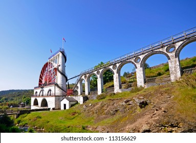 The Great Laxey Wheel with viaduct on sunny day - Isle of Man