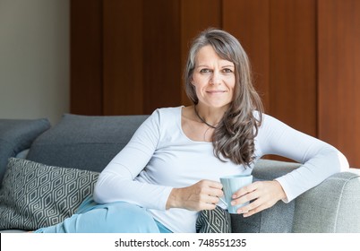 Great Looking Middle Aged Woman Having A Calm Morning And Enjoying Her Coffee