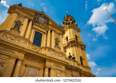 Great Low Angle View Of Munich's Theatine Church Of St. Cajetan, A Catholic Church In Italian High-Baroque Style. Its Mediterranean Appearance And Yellow Façade Became A Famous Symbol For The City.