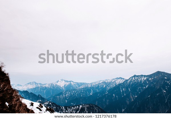Great nature view of snow\
mountain of Japan Alps on Tateyama Kurobe Alpine Route. Toyama -\
Japan