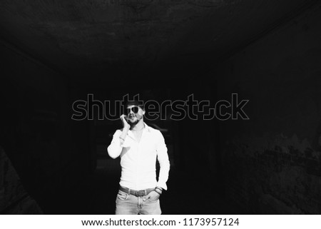 Similar – Man with sun hat and sunglasses on an old bridge