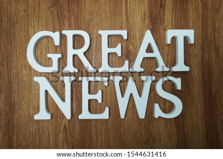 Great News word alphabet letters on wooden background