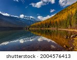 Great Northern Mountain reflects into Stanton Lake in autumn in the Flathead National Forest, Montana, USA