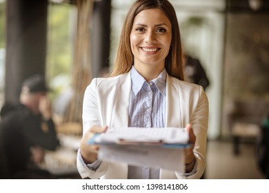 Great Offer Should Not Be Rejected. Business Woman Standing In Office Holding Document.