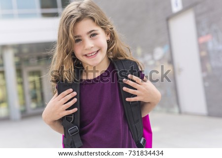 The Great Portrait Of School Pupil Outside Classroom Carrying Bags